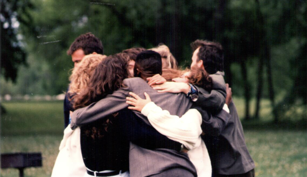 Friends embracing outdoors showing connection ING energy in relationships