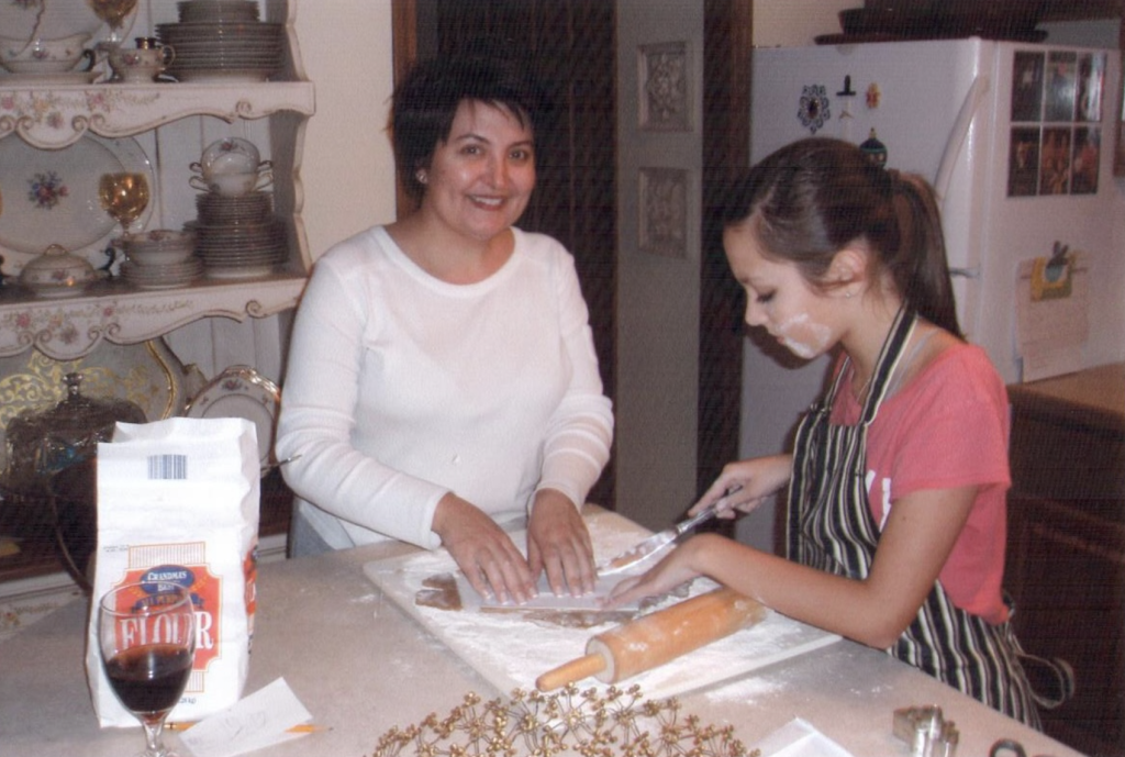 Mother teach ING daughter to bake, demonstrating Mastery of ING energy through effective instruction